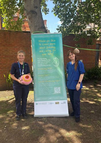 A roller banner with two Trust staff members highlighting caring for your baby