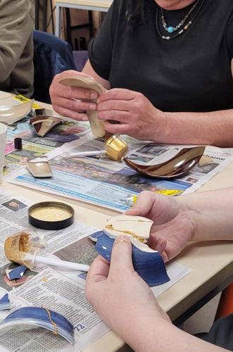 Image of two people making crafts