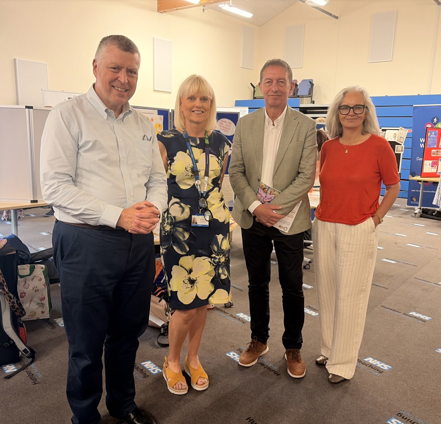 NHS Alliance Chief Executive Sir Ciarán Devane and Director Matthew Hopkins with CEO Michele Moran and Trust Chair Caroline Flint